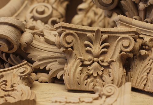 Decorative carved wooden element for furniture decoration