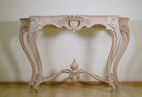 Designer console with curved legs and carved pattern