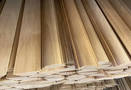 Various types of wooden siding and decorative trim for wall finishing
