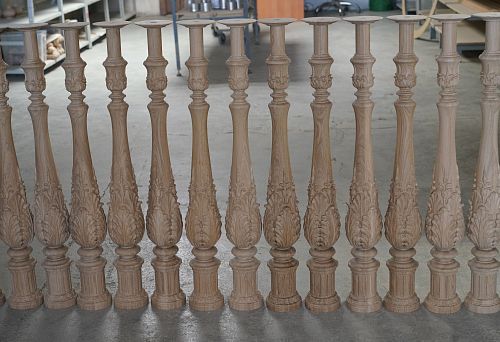 Row of Carved Wooden Balusters with Floral Ornament, Ready for Installation