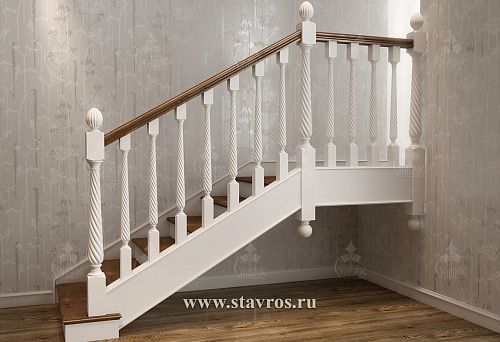 White twisted balusters and wooden handrails on stairs in a light interior