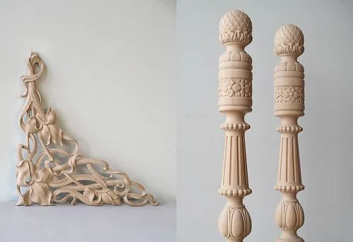 various carved wooden elements: delicate angular decoration with floral ornament and a pair of turned balusters with carved details
