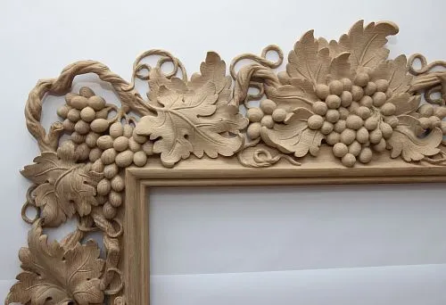 Carved wooden frame with grapevine for picture decoration