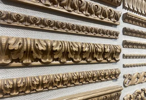 Carved Decorative Moldings of Various Profiles and Sizes, Displayed at the Booth