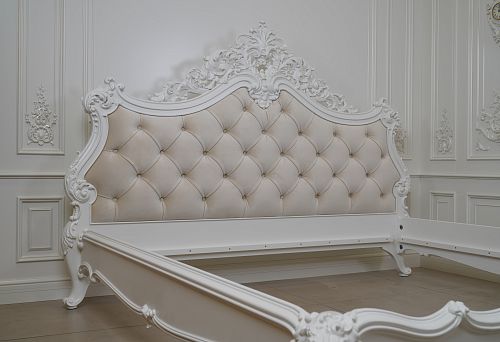 Elegant bed in classic style with velvet upholstery