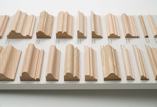 Stand with samples of planed wooden rails of various profiles and sizes made of beech and oak