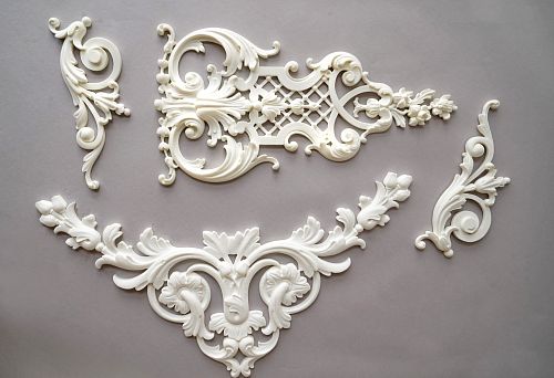 Set of decorative polyurethane elements with floral patterns and scrolls
