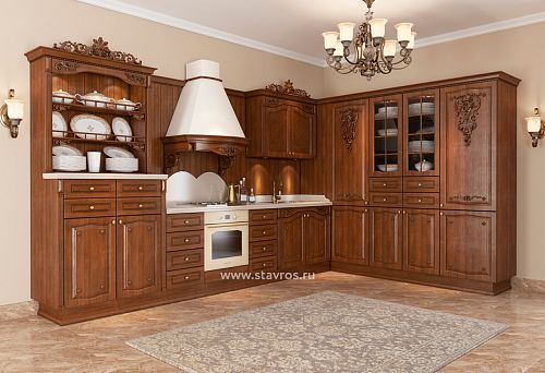Classic kitchen with wooden range hood trim and carved facade