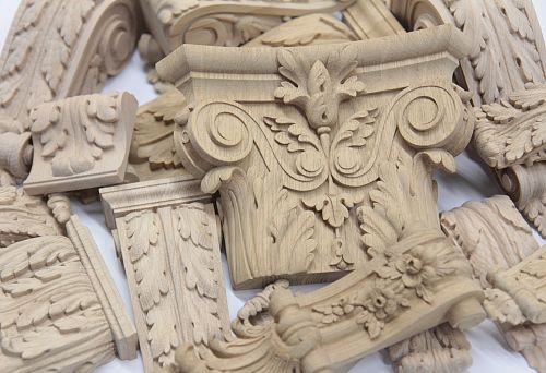Carved wooden decorative elements for interior finishing, creating an elegant and refined style
