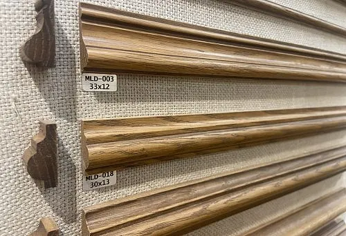 Wooden moldings on display with dimensions and models for interior decoration