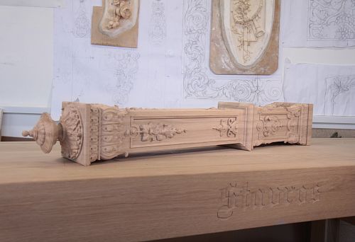 Carved wooden interior element with floral ornament and classic profile