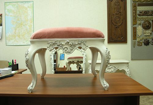 Elegant solid wood side table with curved legs and refined design.