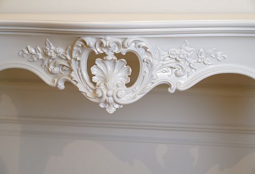 Carved decorative pattern on a white table &ndash; art in every detail