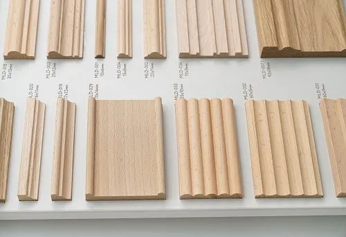 Set of samples of wooden profiles of various shapes and sizes, illustrating modern processing technologies