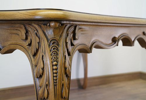 Carved wooden bed with handcrafted decorative elements