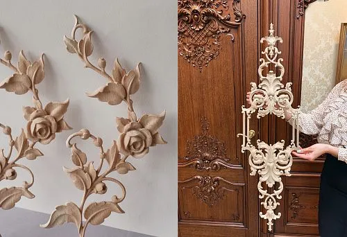 Elegant carved wooden element before the door with luxurious decoration.