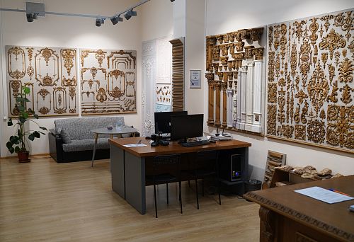 Office Interior with Exhibition of Decorative Wooden Items and Carved Overlays