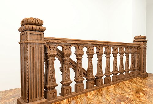 Wooden balustrade with decorative support posts installed on a stone floor