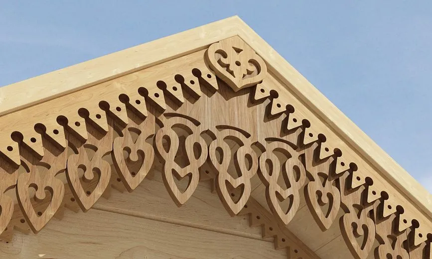 Close-up of carved cornice with traditional patterns.