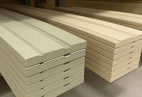 Wooden skirting board profiles in the store on the shelf