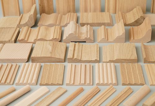 Unpainted wooden strips and strips of different profiles from oak and beech, samples for furniture and interior finishing