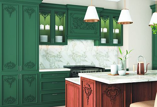 Interior of a modern kitchen made of natural wood with carved facades in deep green color