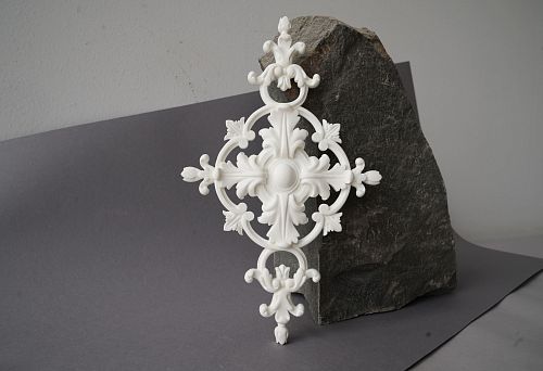 Polyurethane Decorative Element with Classic Ornamentation Against Stone Background