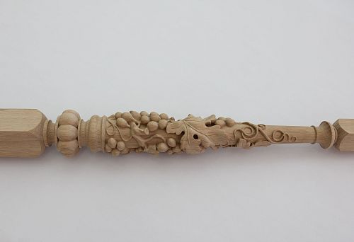 Carved wooden baluster-leg with grapevine ornament