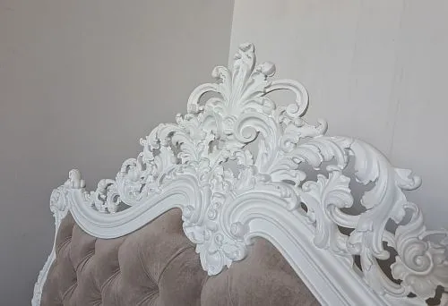 Classic headboard with white carved decoration &ndash; elegance in details