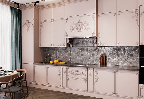 Kitchen with classic-style facades, decorative elements, and a countertop imitating natural wood, against a gray-glossy backsplash.