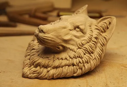 Hand-carved wooden wolf sculpture