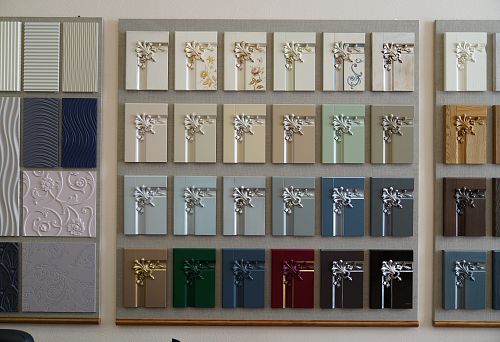 Collection of furniture facade samples with carved decorative inserts in various colors