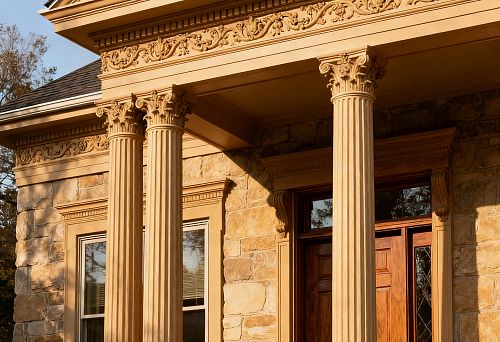 Facade decoration for a house with columns and carved architectural elements