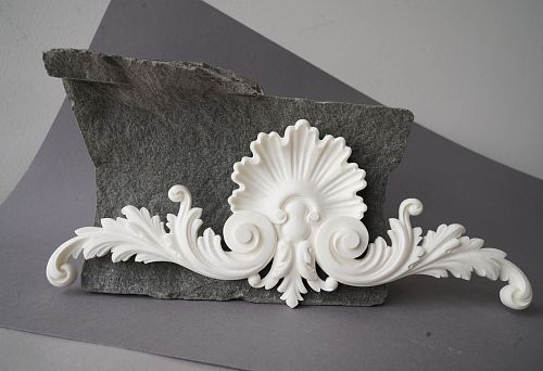 Polyurethane decorative element for modern interior on gray background