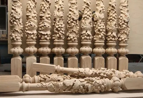 Carved balusters from solid wood with three-dimensional decorative elements,