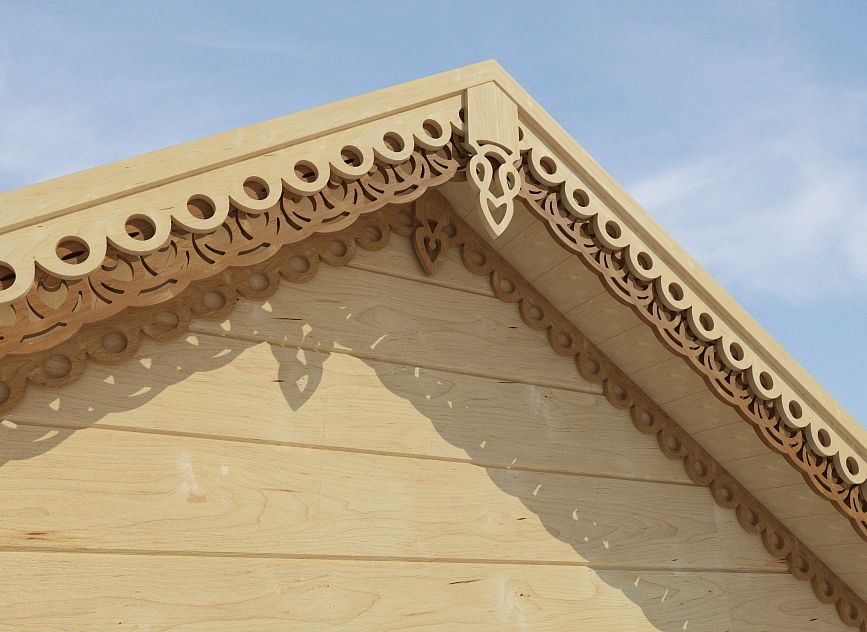 Wooden house gable adorned with delicate wood carving