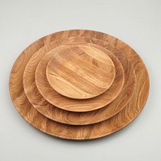 Set of wooden plates demonstrating wood grain texture and pattern.