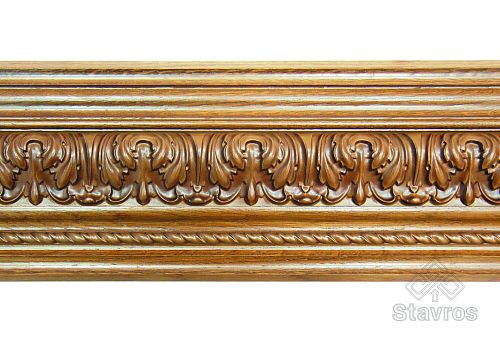 Carved wooden casing with relief ornament, adorned with classical elements