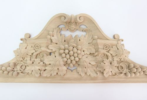 Wooden carved panel with leaf and grapevine composition