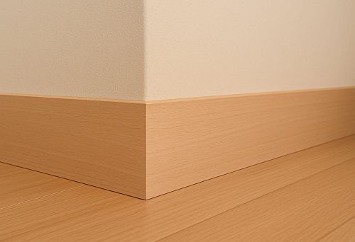 Straight light oak skirting board with smooth surface in modern interior