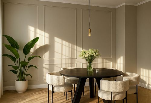 Modern Dining Room with a Round Wooden Table and Soft Armchairs