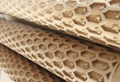 Oak trim items with carved hexagonal pattern, made in workshop.