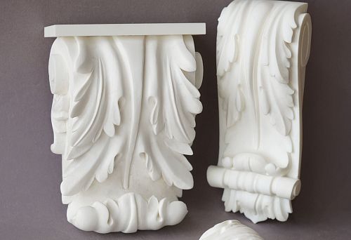 Decorative polyurethane brackets on a gray background