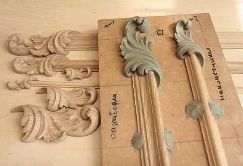 Decorative carved elements from wood during processing.