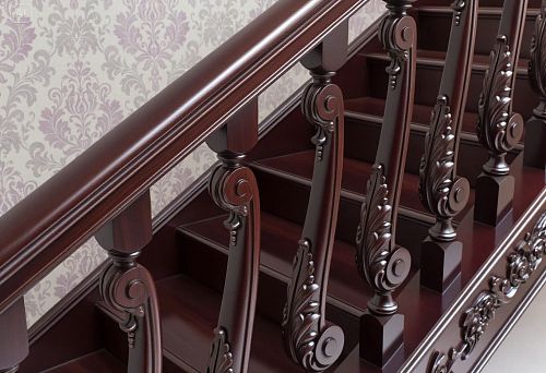Staircase with carved dark wooden balusters in a classical interior