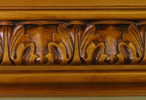Wooden molding with an elegant carved pattern after staining.