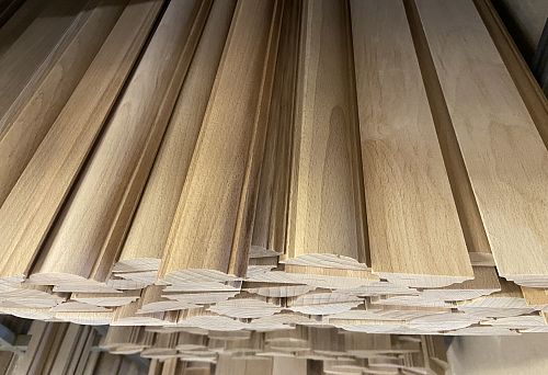 Packages of wooden planks for interior wall finishing