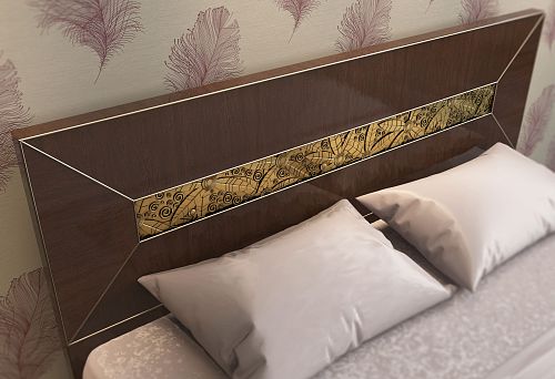 Close-up of a bed headboard with dark wood finish and decorative inlay with gold pattern
