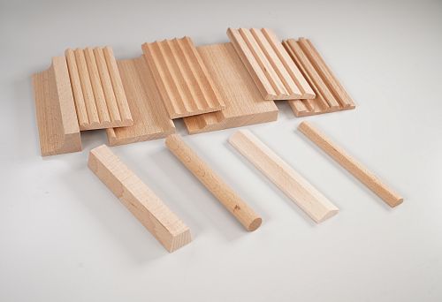 Various options of wooden rails with different cross-sections and shapes
