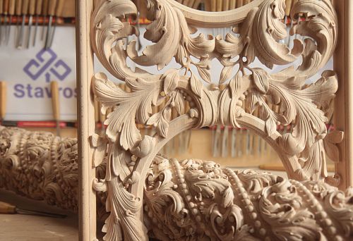 Carved wooden relief with floral ornament in classic style